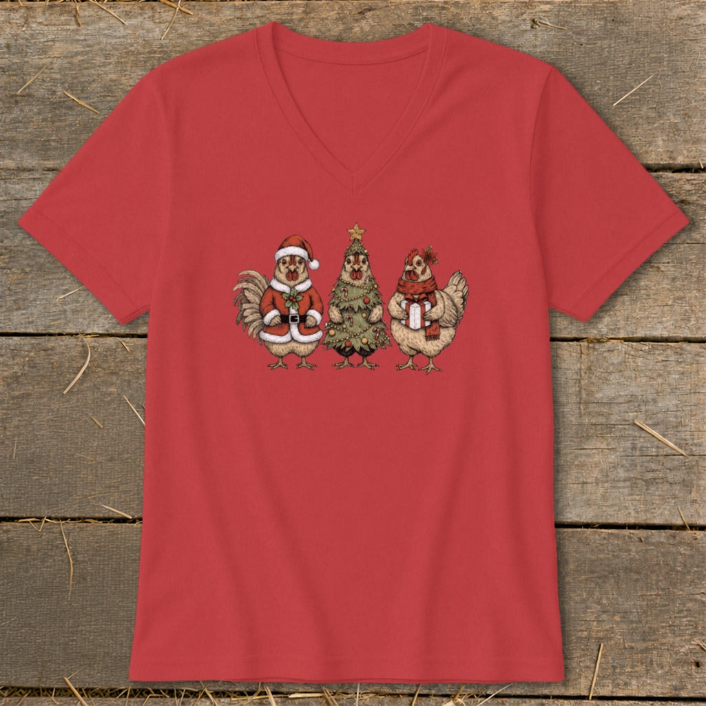 Three chickens, one in a Santa suit, one as a Christmas tree, one holding a gift.