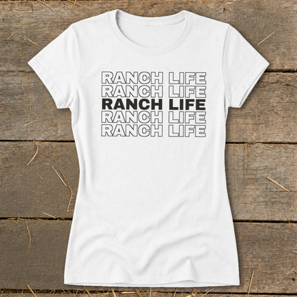 A white short-sleeved t-shirt with five stacked rows of the text RANCH LIFE, with the middle row solid black.