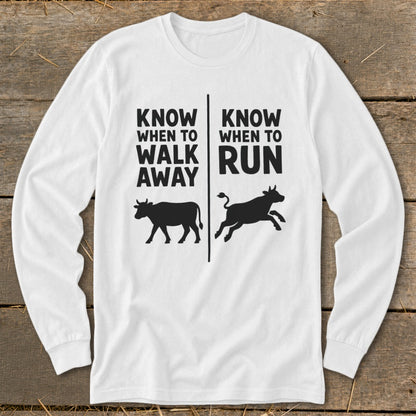 White long-sleeve shirt with "Know When to Walk Away" and "Know When to Run" text and cow graphics.