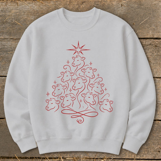 White sweatshirt with red line art Christmas tree made of cows.