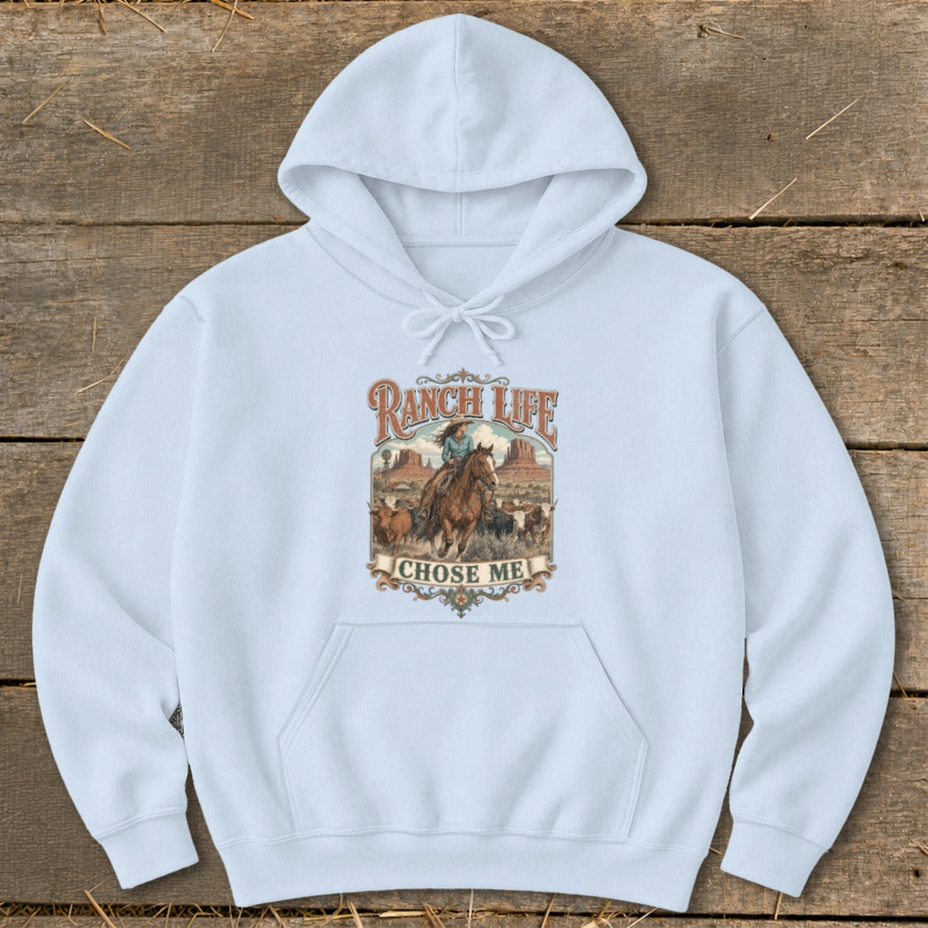 Light blue hoodie with "Ranch Life Chose Me" graphic of a woman on horseback with cattle.