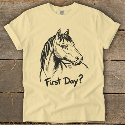 Light yellow t-shirt with black horse head graphic and "First Day?" text.