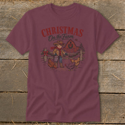 T-shirt graphic with text "Christmas on the Farm" shows a boy feeding chickens.