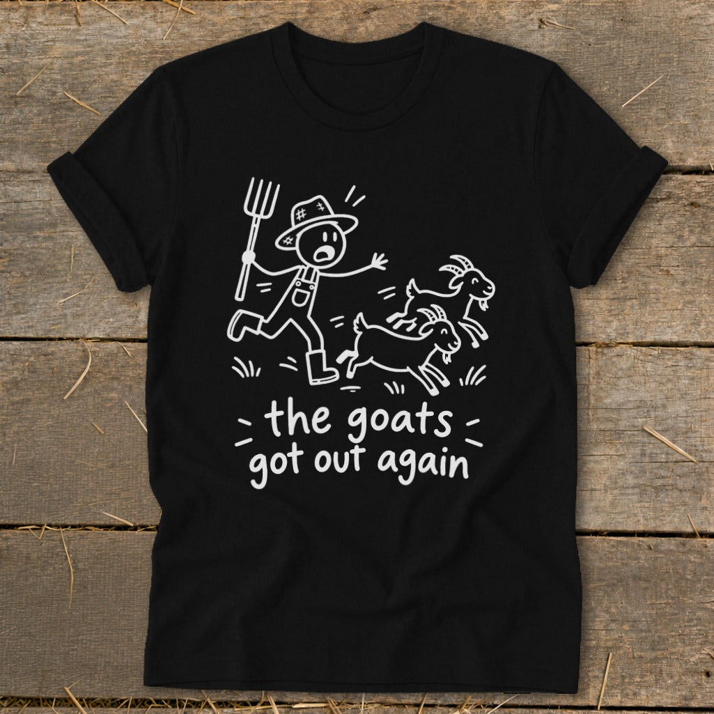 Black t-shirt with cartoon farmer chasing goats and text "the goats got out again".