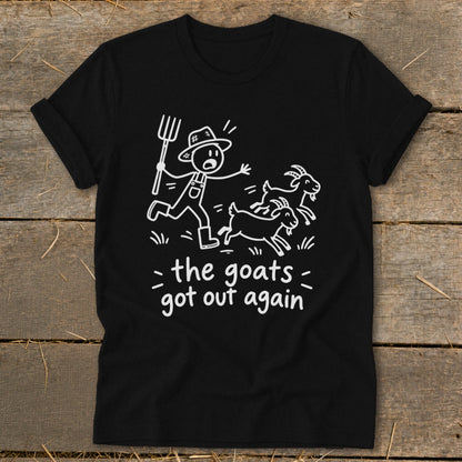 Black t-shirt with cartoon farmer chasing goats and text "the goats got out again".