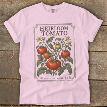 Pink t-shirt with "Heirloom Tomato" and vintage tomato plant illustration.