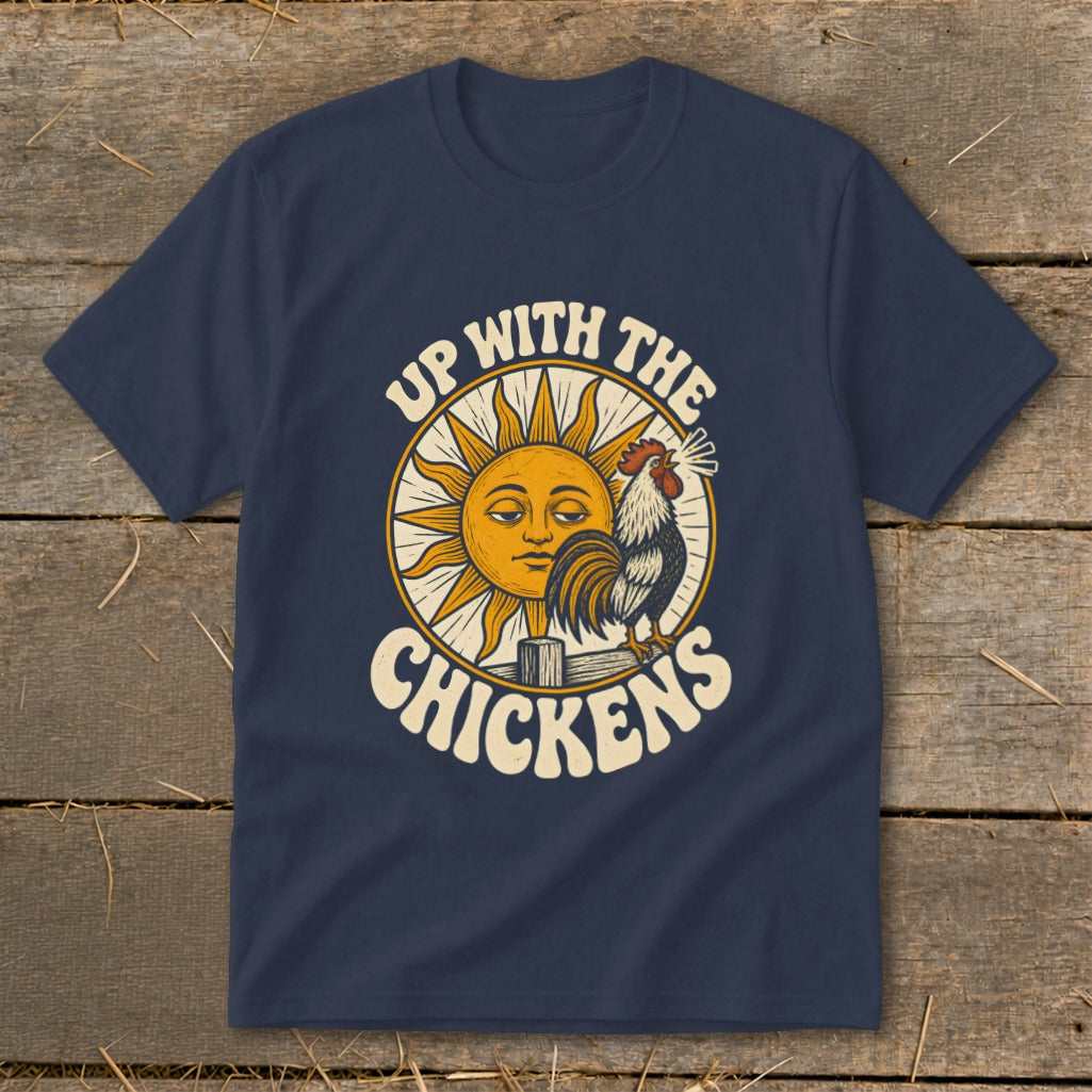 Dark blue t-shirt featuring a retro graphic of a crowing rooster and a smiling sun with text reading UP WITH THE CHICKENS.