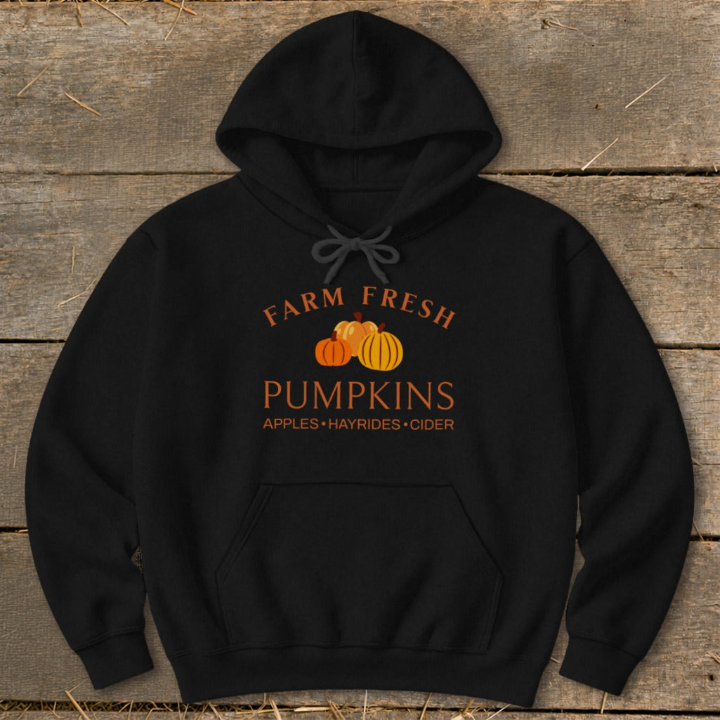 Black hoodie with "Farm Fresh Pumpkins Apples Hayrides Cider" text and pumpkins graphic.