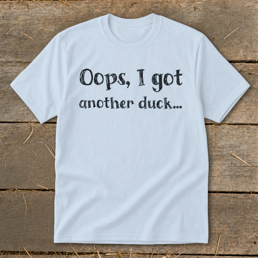 Light blue t-shirt with black text "Oops, I got another duck..."
