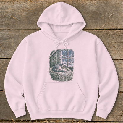 Pink hoodie with a drawing of a sleeping cat by a snowy window.