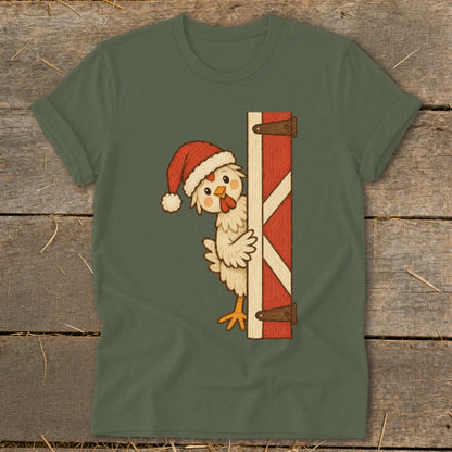 Chicken wearing Santa hat peeking from behind a red barn door.