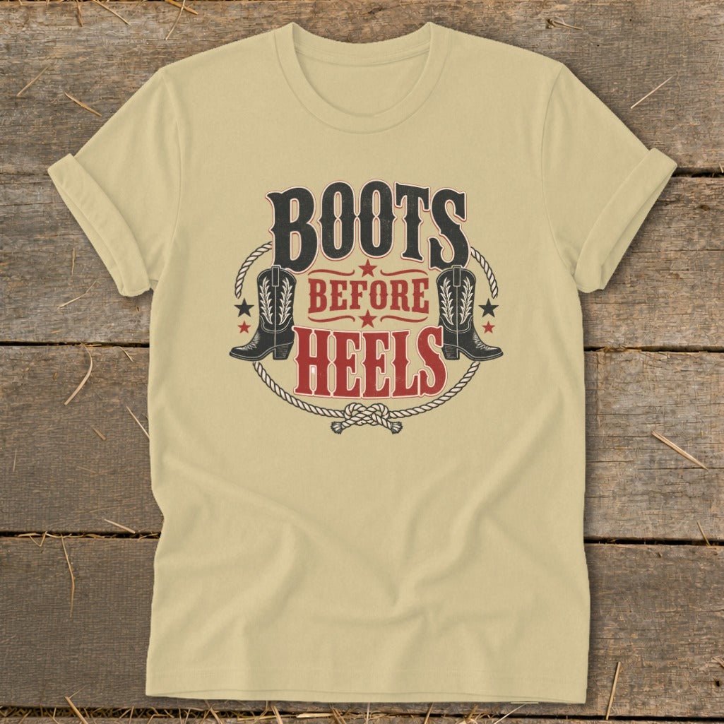 Light yellow t-shirt with "BOOTS BEFORE HEELS" text and cowboy boots graphic.