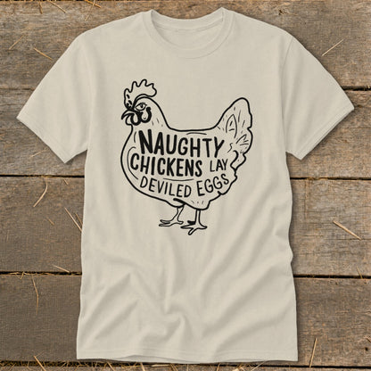 Cream t-shirt with black graphic of a chicken and text "Naughty Chickens Lay Deviled Eggs".