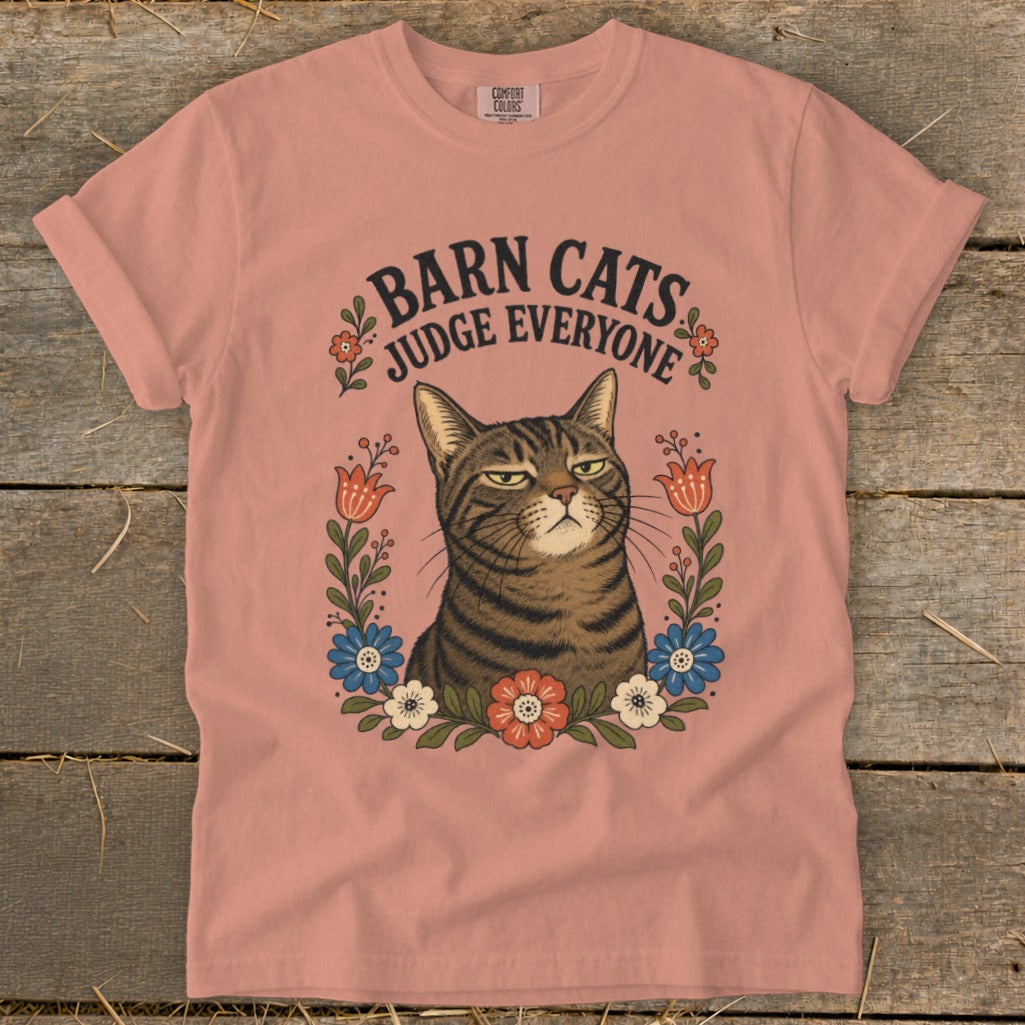 T-shirt with a tabby cat print surrounded by flowers and text "Barn Cats Judge Everyone".
