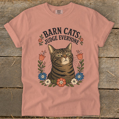 T-shirt with a tabby cat print surrounded by flowers and text "Barn Cats Judge Everyone".