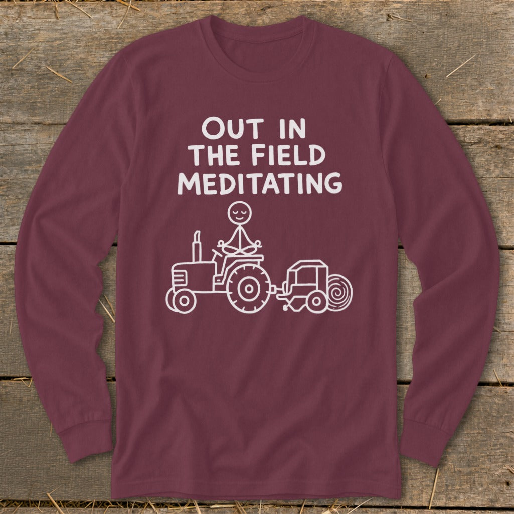 Maroon long-sleeve shirt with "Out in the Field Meditating" text and tractor graphic.