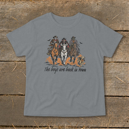 Three costumed figures on horses with a dog, text reads "The boys are back in town".