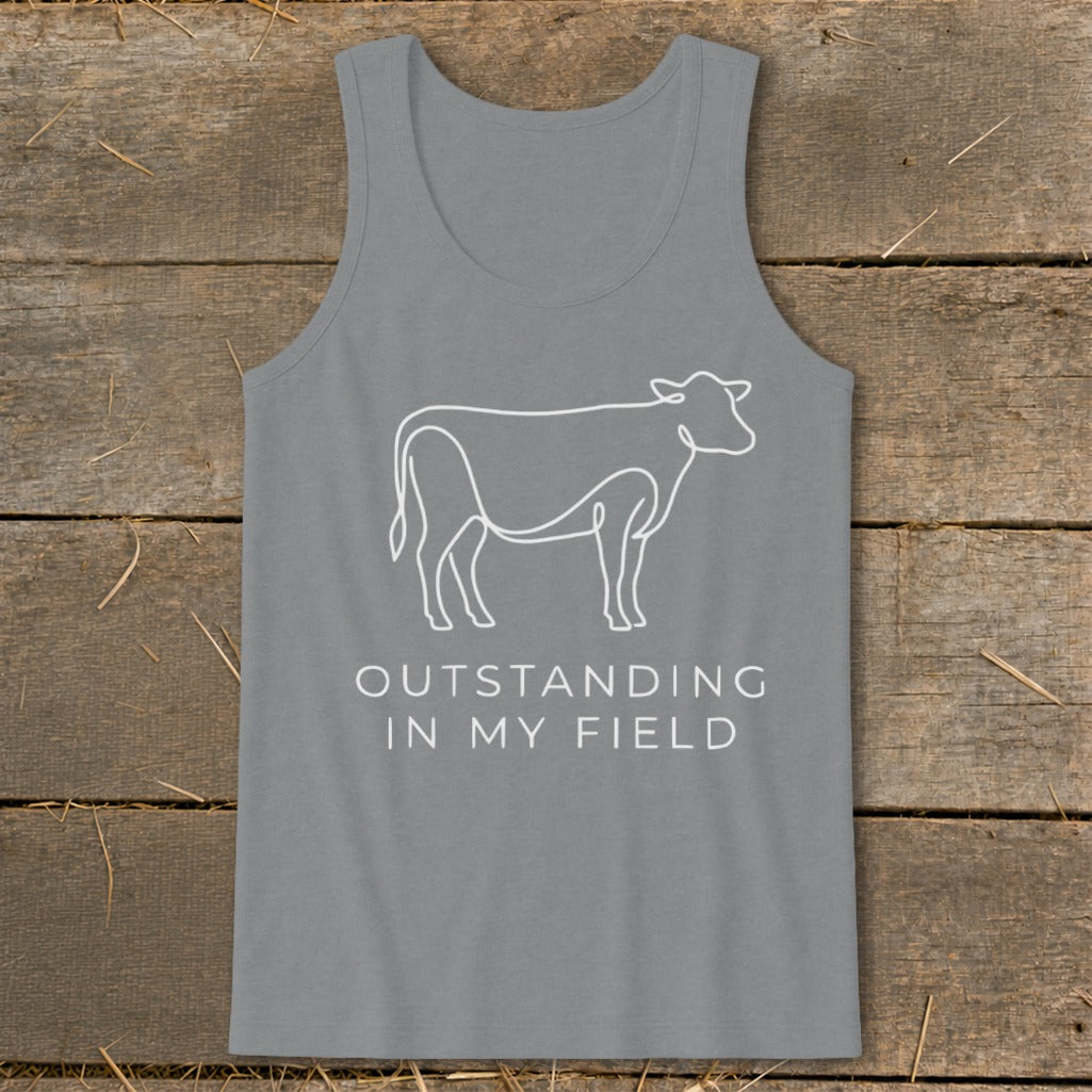 Grey tank top with white line art cow and text "OUTSTANDING IN MY FIELD".