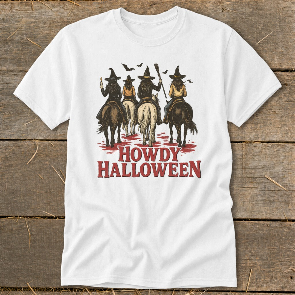 White t-shirt with four witches on horseback and the text "HOWDY HALLOWEEN".