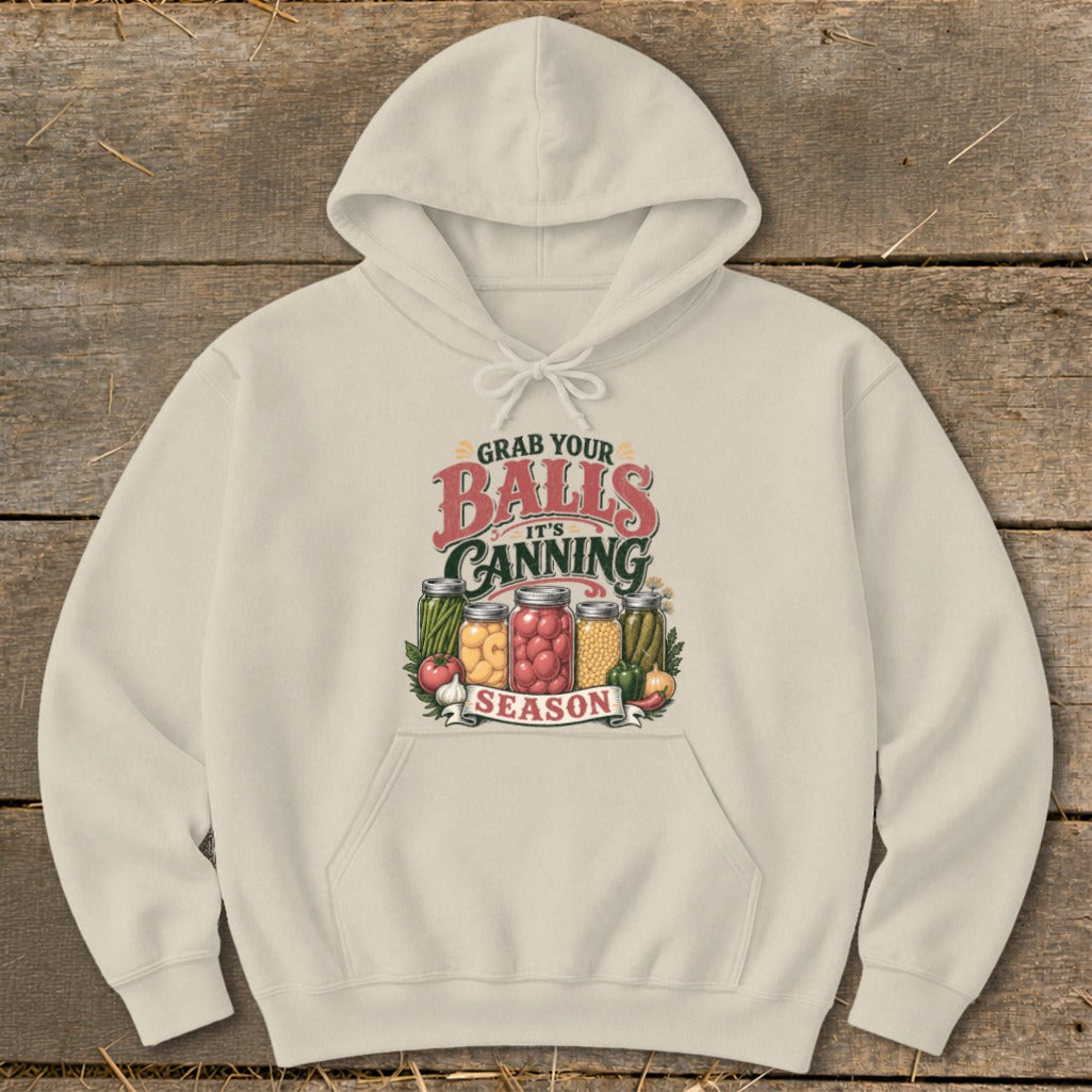 Cream hoodie with "Grab your balls it's canning season" graphic and jars of produce.