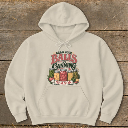 Cream hoodie with "Grab your balls it's canning season" graphic and jars of produce.