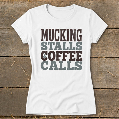 White t-shirt with "Mucking Stalls Coffee Calls" text in brown and grey.