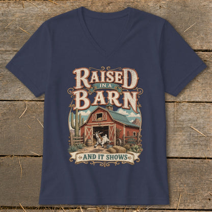 Navy v-neck shirt with "Raised in a Barn and It Shows" graphic and goat.