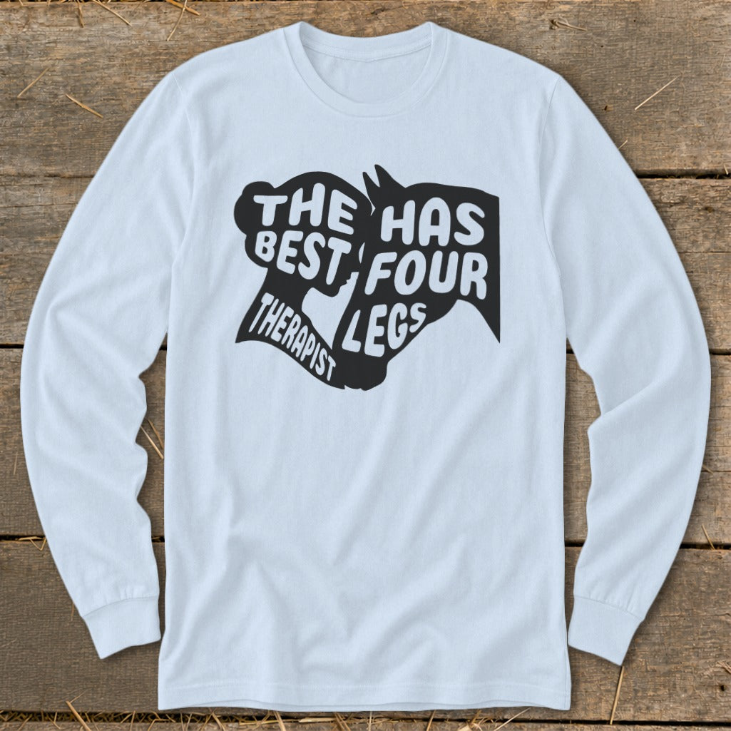 Light blue long sleeve t-shirt with black graphic "The best therapist has four legs".