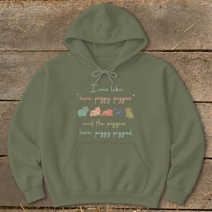 Olive green hoodie with text "I was like 'here piggy piggies' and the piggies here piggy piggied".