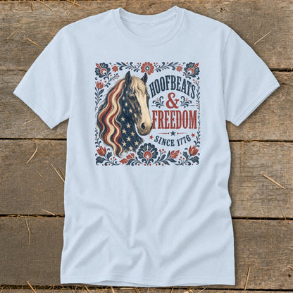 Light blue t-shirt with horse graphic and text "Hoofbeats & Freedom Since 1776".