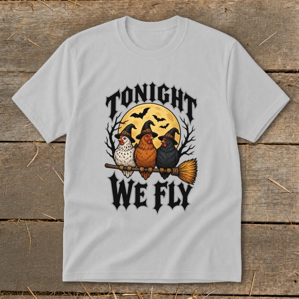 Three chickens in witch hats ride a broomstick with "Tonight We Fly" text.