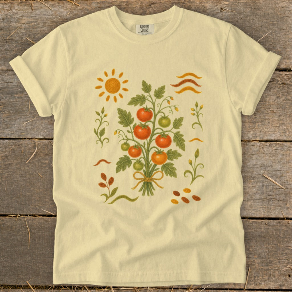 Cream t-shirt with a central tomato plant illustration surrounded by decorative elements.