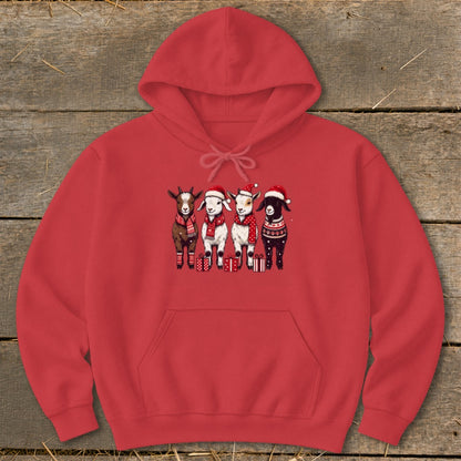 Four cartoon goats in Santa hats and scarves stand with gift boxes on a red hoodie.