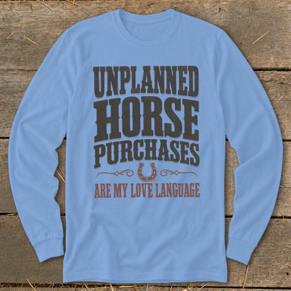 Light blue long-sleeve shirt with "UNPLANNED HORSE PURCHASES ARE MY LOVE LANGUAGE" text.