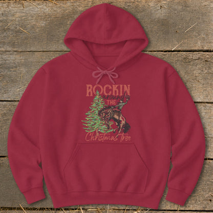 Maroon hoodie with "Rockin Around The Christmas Tree" graphic of a cowboy on a bucking bronco.