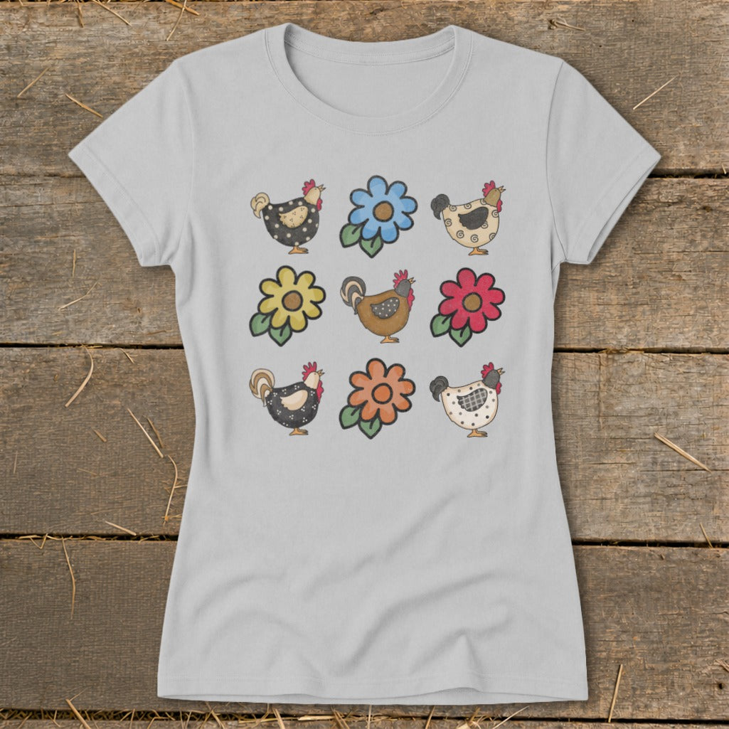 Grey t-shirt with a grid of nine watercolor chickens and flowers in various colors.