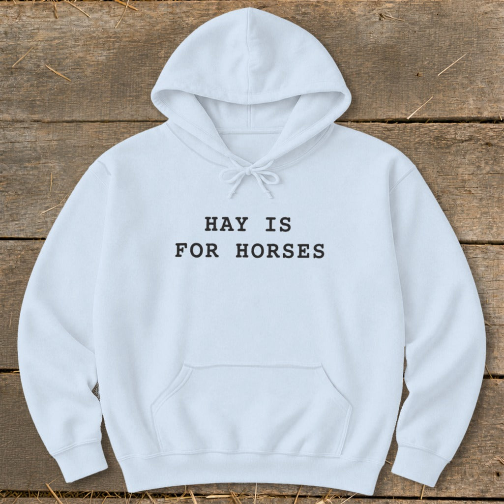 White hoodie with "HAY IS FOR HORSES" text on front.