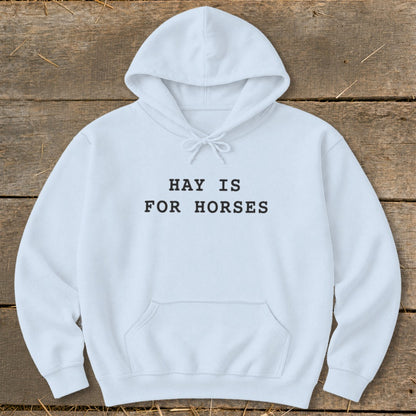 White hoodie with "HAY IS FOR HORSES" text on front.