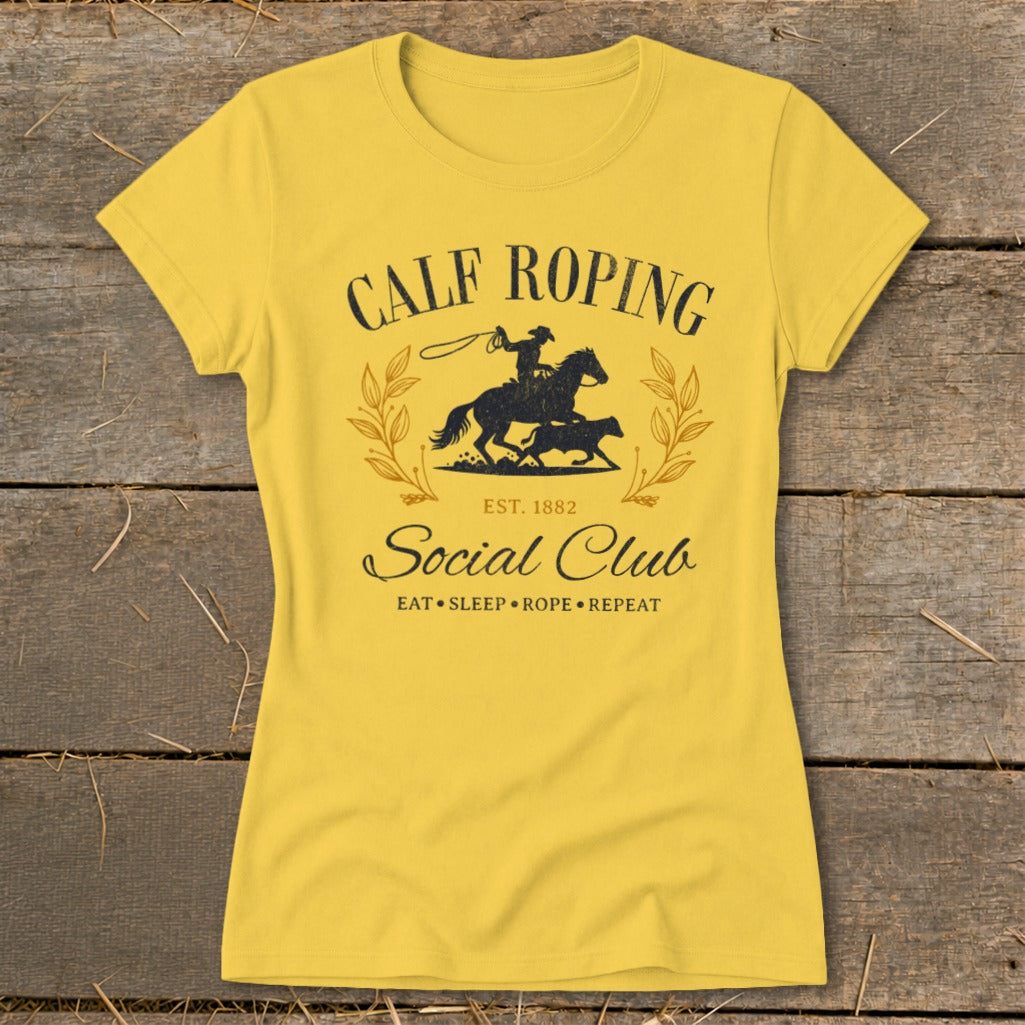 Yellow t-shirt with "Calf Roping Social Club Est. 1882" graphic.