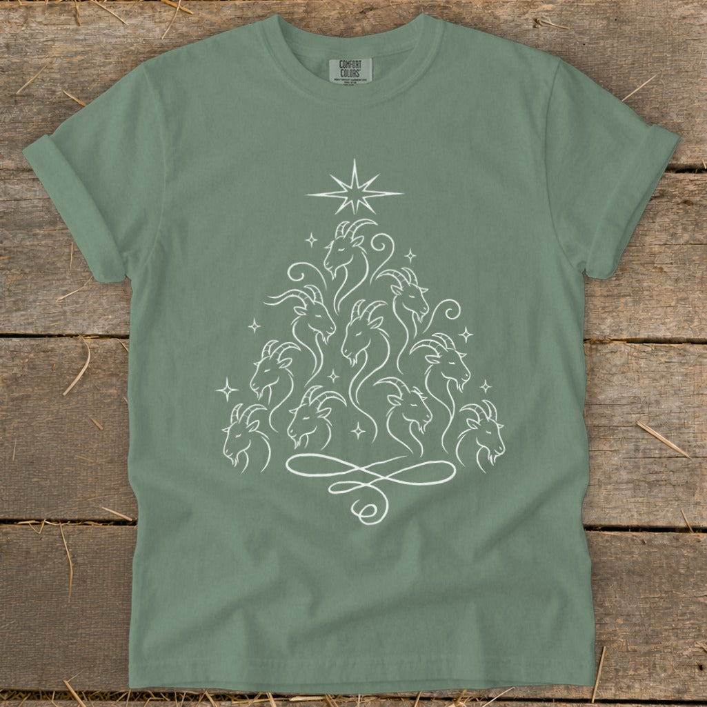 Green t-shirt with white line art of goats arranged in a Christmas tree shape.
