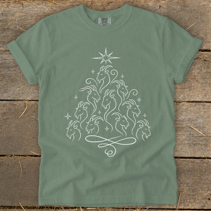 Green t-shirt with white line art of goats arranged in a Christmas tree shape.