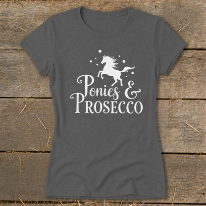 Dark gray t-shirt with white text "Ponies & Prosecco" and a horse graphic.