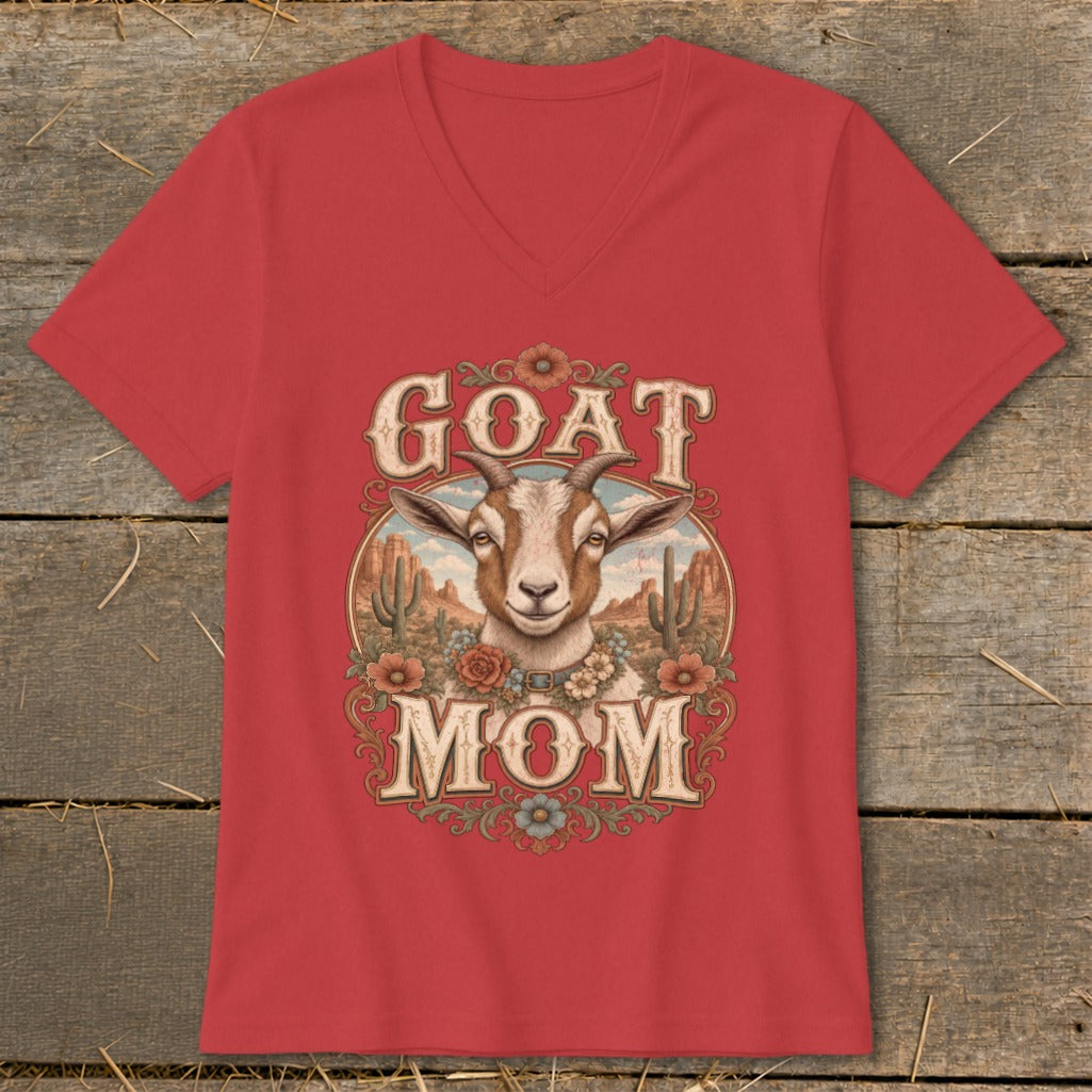 Red t-shirt with "GOAT MOM" text and a goat's head in a desert landscape design.