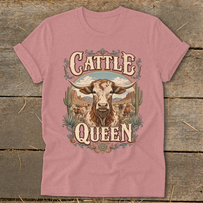 Pink t-shirt with "Cattle Queen" text and a longhorn steer in desert landscape.