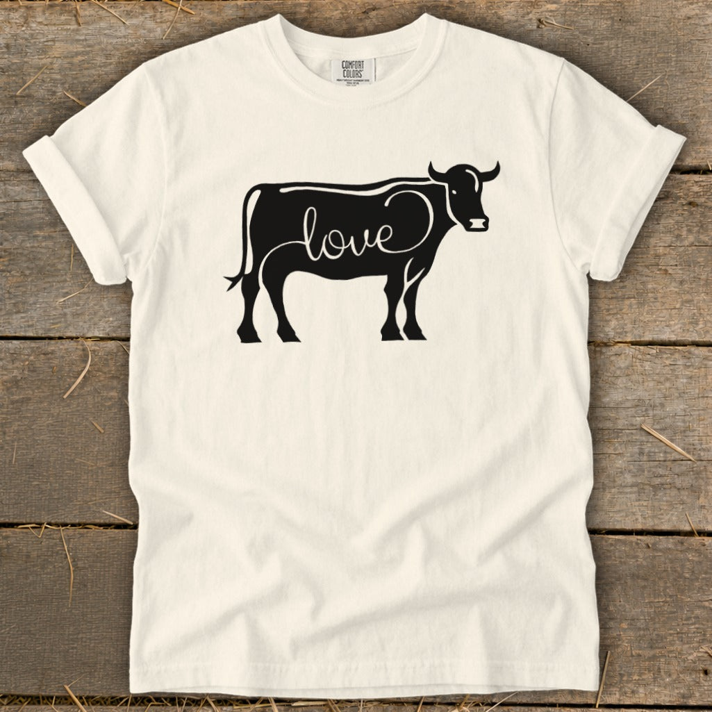 Cream t-shirt with black cow silhouette featuring the word "love" written inside.