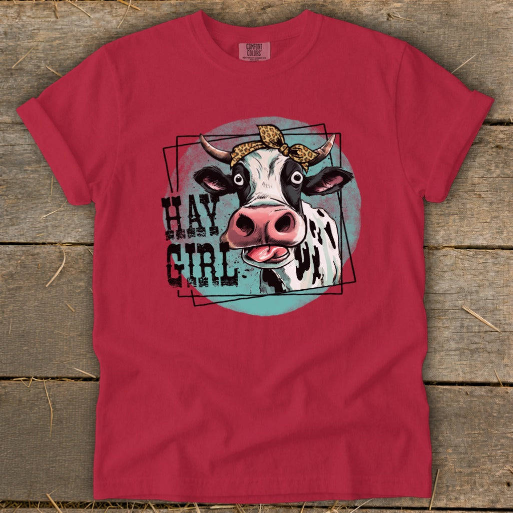 Red t-shirt with a cartoon cow wearing a leopard print bandana, text says "HAY GIRL".