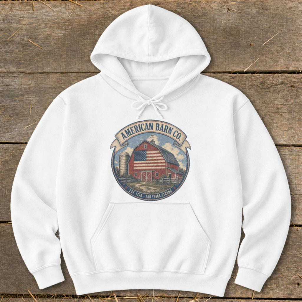 White hoodie with circular "American Barn Co." logo featuring a barn, flag, and silo.
