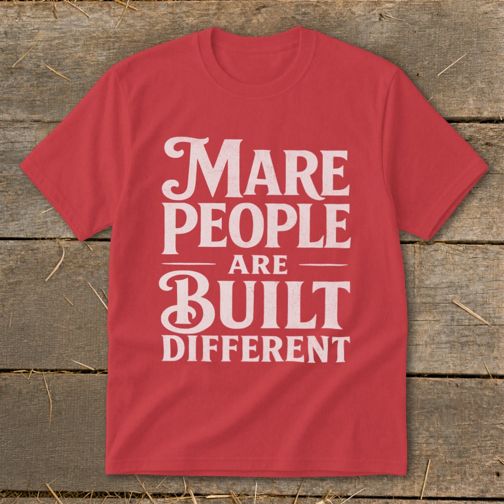 Red t-shirt with white text: "Mare People Are Built Different".