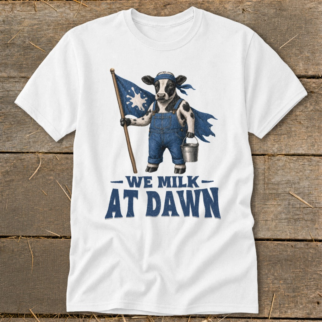 Cow in overalls holding a flag and bucket with text "We Milk At Dawn".