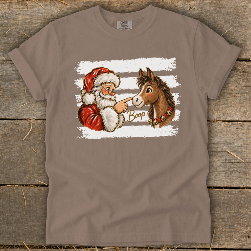 Santa booping a horse's nose with the word "Boop" on a taupe t-shirt.